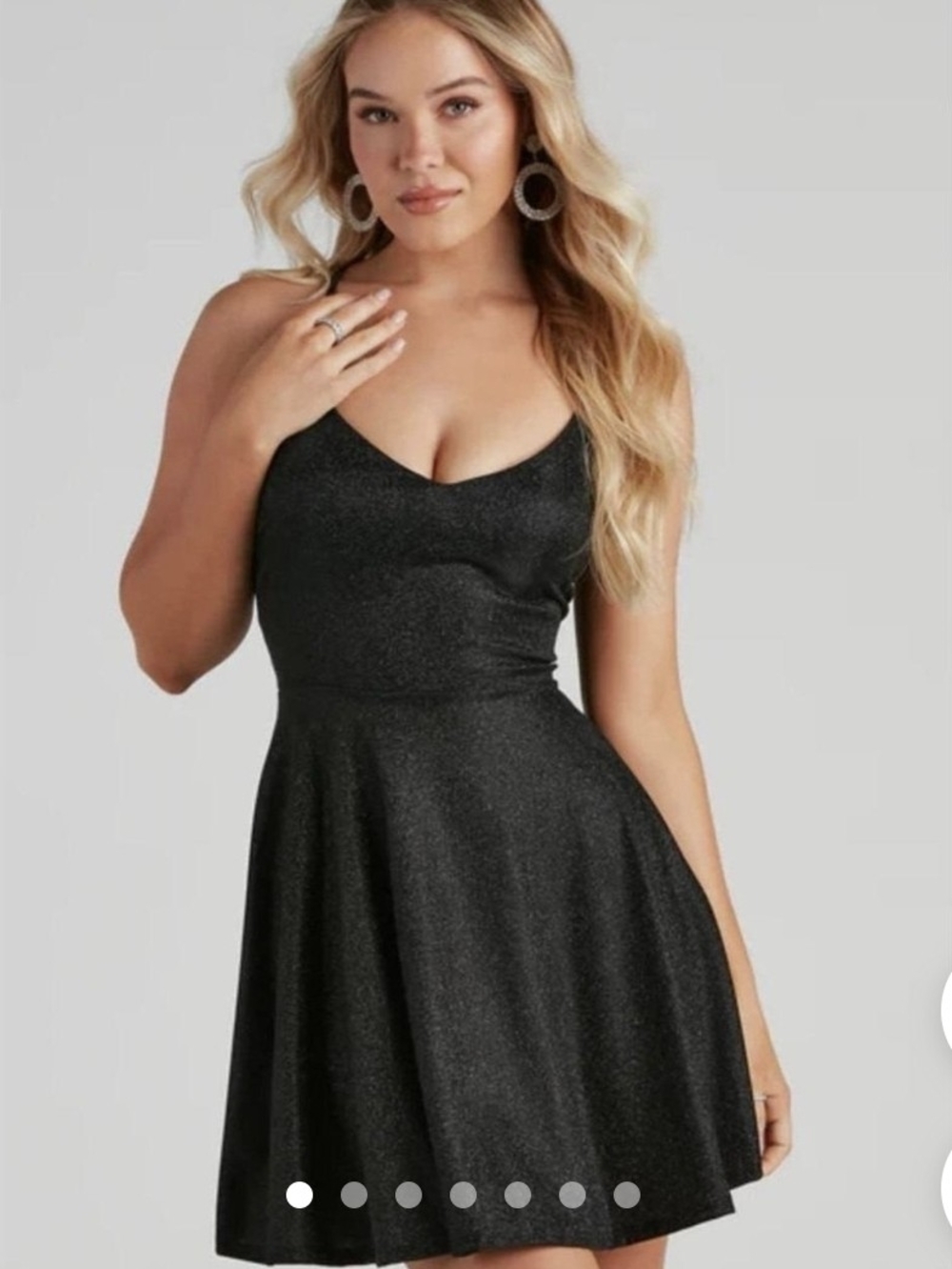 black Windsor glitter glow skater dress with spaghetti straps and a v-neckline.